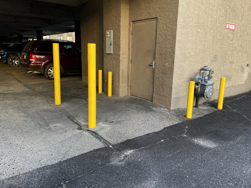 line painting bollard poles in Kelowna, BC by Silver Star Line Marking